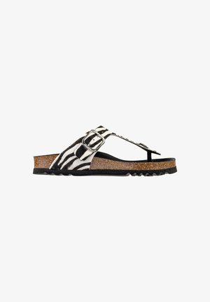 Sandalo open-toe con cinturini con stampa zebrata, fibbia argento, plantare in sughero e suola nera strutturata, mostrato di profilo laterale.