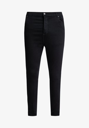 Schwarze Slim-Fit-Jeans mit Vorderknöpfen und Reißverschluss, im Fünf-Taschen-Stil und mit Gürtelschlaufen.