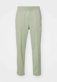 Nike Sportswear Träningsbyxor - mint