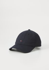 Navy baseball cap made of cotton with a curved brim. Features a small red, white, and blue logo on the front. Smooth texture.