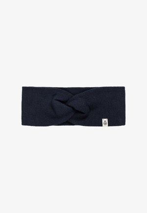 Navy knitted headband with a twisted knot detail at the front and a small label on the side. Soft texture and elastic fit for comfort.