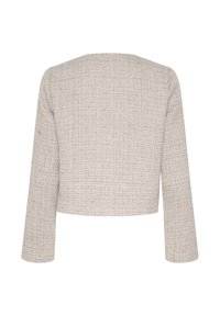 Rövidített zakó, texturált bézs szövetből, négyzetrácsos mintával, hosszú ujjakkal és kerek nyakkivágással. Nincsenek látható zárak vagy díszítések.