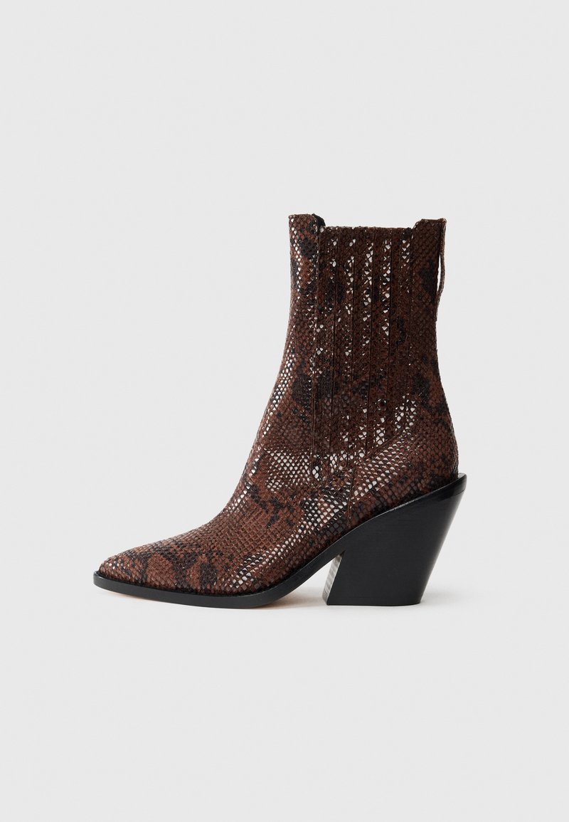 Brown snake-patterned ankle boot with a pointed toe, textured surface, and a black, chunky heel. Features ribbed design at the top.