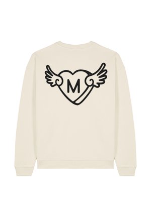 Sweatshirt couleur crème avec un grand cœur noir aux ailes et la lettre 'M' au centre dans le dos. Matière en mélange de coton.