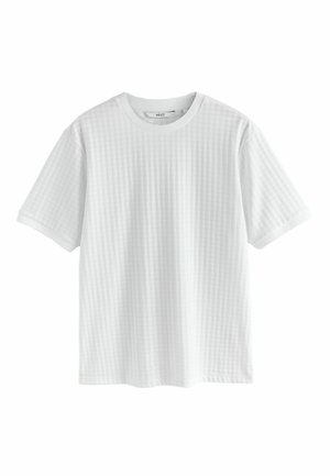 White short-sleeve t-shirt with a textured check pattern, round neckline, and contrasting solid-colored cuffs. Made from lightweight fabric.