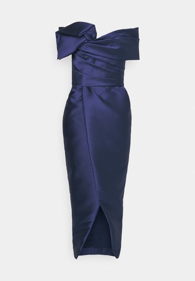 Navy satin dress with off-shoulder design, pleated bodice, and a fitted silhouette that tapers to a knee-length hem with a side slit.