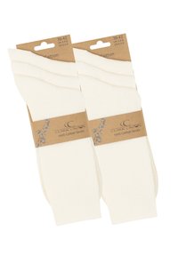 Calzini bianchi in cotone con una texture a costine e bordi elasticizzati, confezionati con un cartoncino marrone che presenta il nome del marchio e i dettagli sulla taglia.