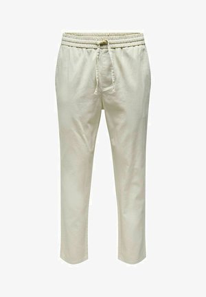 Beige jogger pants with an elastic waistband and drawstring. Made of soft fabric, featuring tapered legs and no visible pockets.