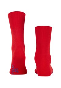Pair of bright red mid-calf running socks with ribbed cuffs, displayed upright, showing heel and sole area with blue text on one sock.