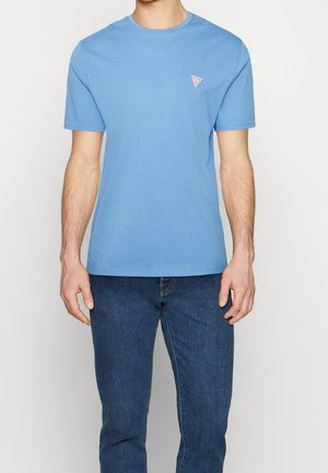 Light blue cotton t-shirt with a round neckline and short sleeves, featuring a small triangular logo on the left chest.