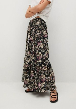 Floral maxi skirt with a dark background featuring pink and cream flowers, tiered design, ruffled hem, elastic waistband, and lightweight fabric.