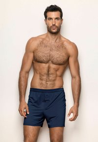 Tmavě modré boxerky s hladkým povrchem, které mají pohodlný pás, dva přední knoflíky a upravený střih.