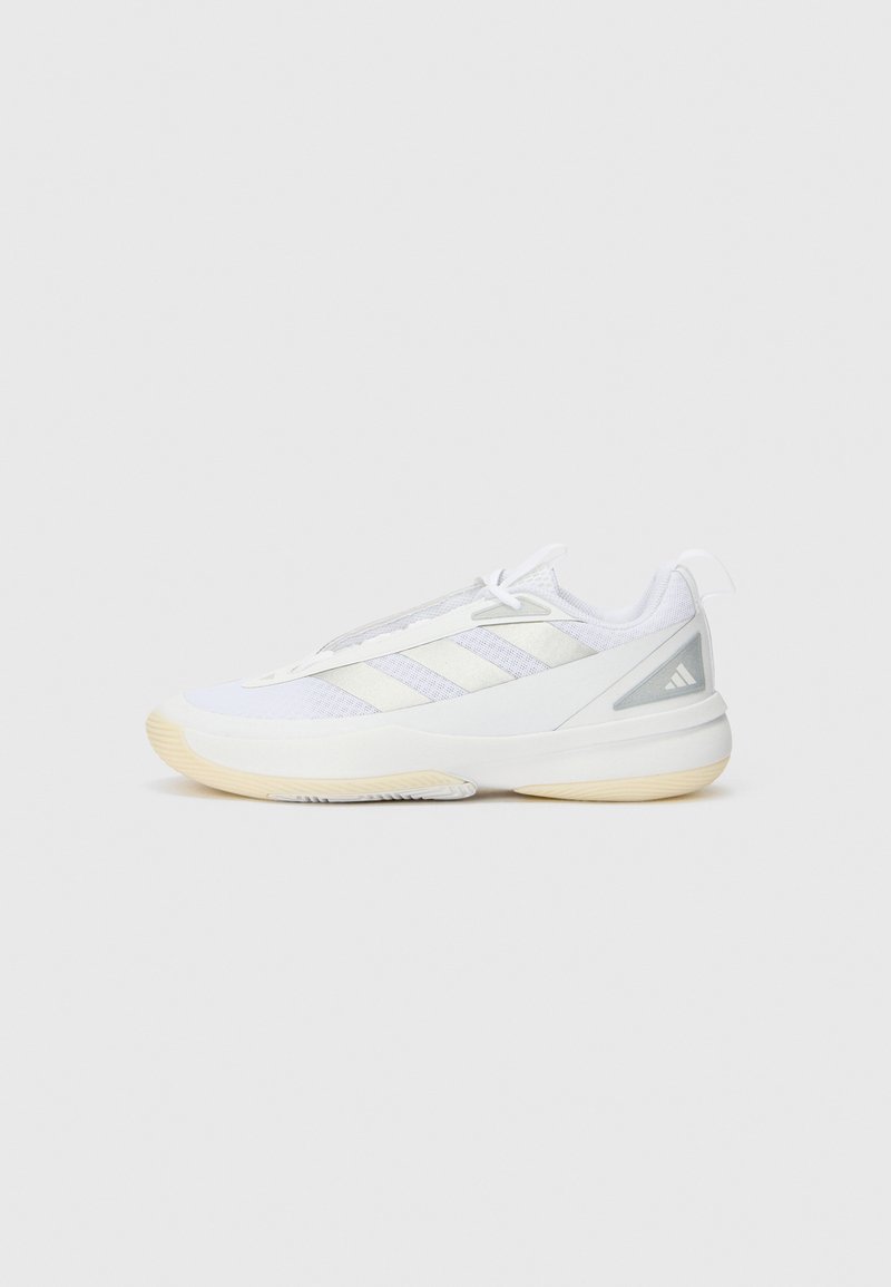 White athletic shoe with a mesh upper, featuring three light gray stripes, textured midsole, and a light rubber outsole for traction.