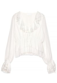 Blusa bianca con collo e polsini arricciati, caratterizzata da un design corto, tessuto testurizzato e lacci regolabili nella parte anteriore e nelle maniche.