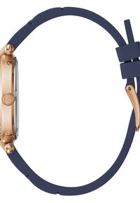 Orologio tondo con cassa in metallo dorato e cinturino in silicone blu navy. Presenta un quadrante in vetro trasparente e un accento dorato sul cinturino.