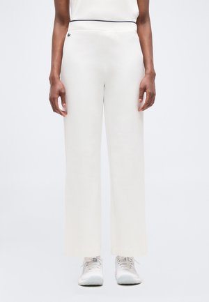 HERITAGE - Tracksuit bottoms - white