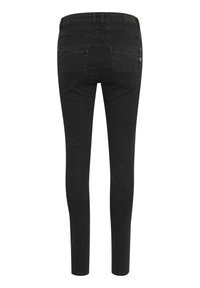 Svarta smala jeans i denim med en slät textur. Har två bakfickor och en märkesläderlapp vid midjan.