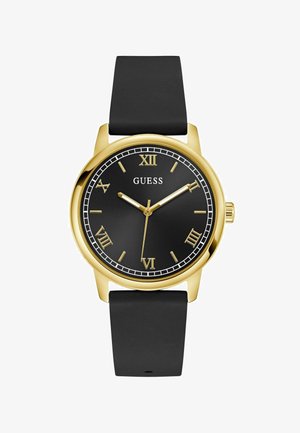 Gold-tone watch with a round black face, Roman numerals, and black silicone strap. Features a thin white outer ring and gold hands.