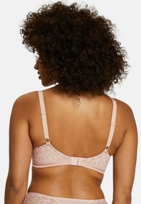 Bra in light pink lace with floral pattern, adjustable straps, and hook closure. Mesh fabric provides a smooth texture.