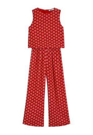 Ensemble composé d'un crop top rouge sans manches et d'un pantalon à jambes larges, avec un motif floral blanc intégral et une taille élastique sur le pantalon.