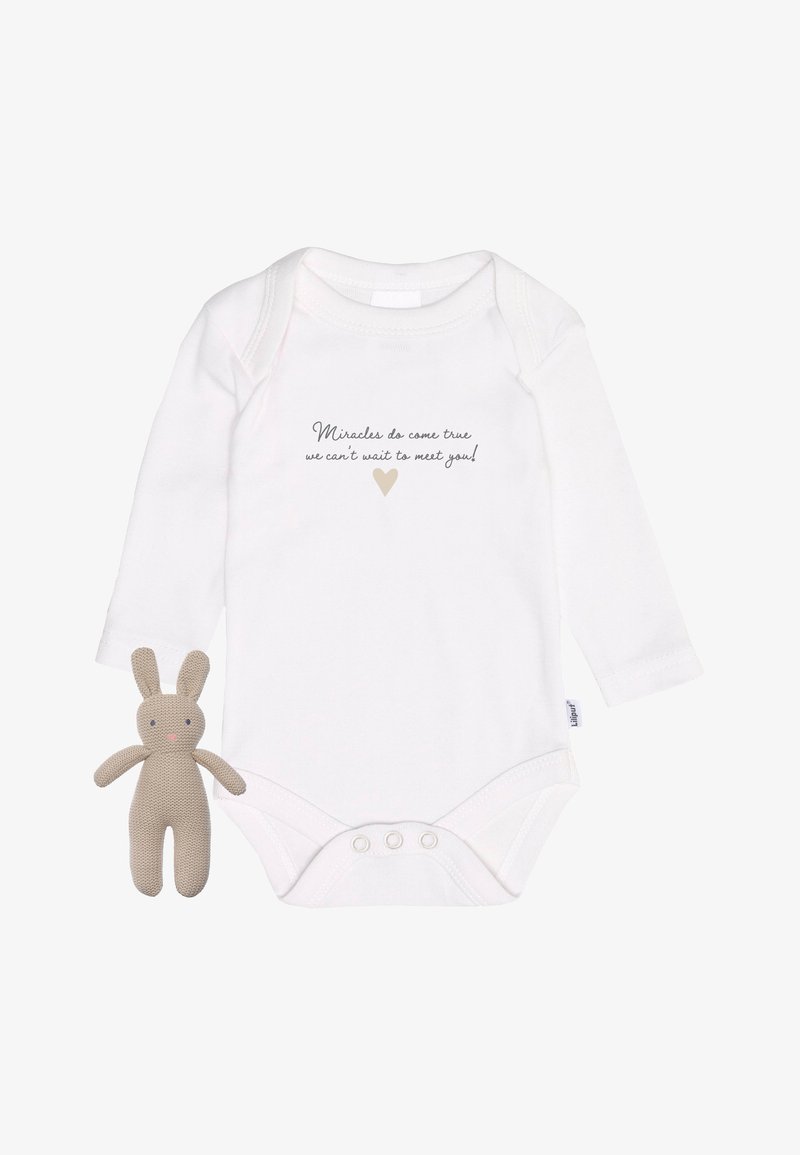 White long-sleeve onesie with printed text and heart; includes a soft beige bunny toy with stitched features and a textured body.