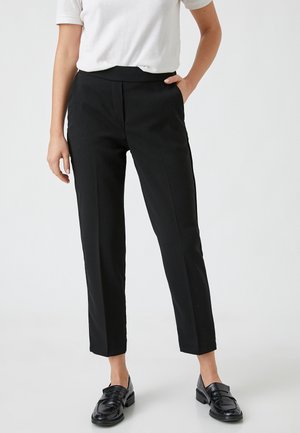 CARROT - Trousers - black