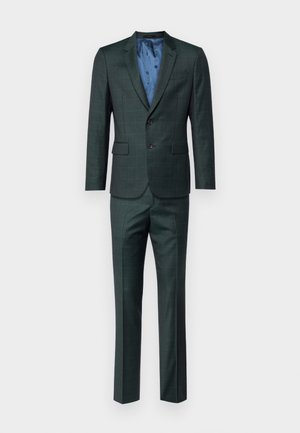 Costum bărbați din țesătură în carouri verzi închise. Dispune de o jachetă cu două butoane, căptușită cu un material cu un model albastru, și pantaloni asortați. Textură netedă.