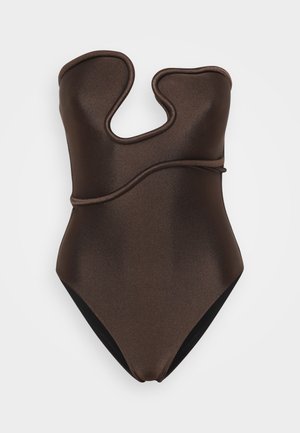 Brown one-piece swimsuit with a glossy finish, featuring a unique wavy cut-out design and solid contrasting black back.