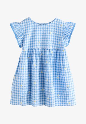 Vestido de cuadros azules y blancos con mangas con volantitos, bordado disperso de pequeñas margaritas blancas y amarillas, y cintura fruncida.