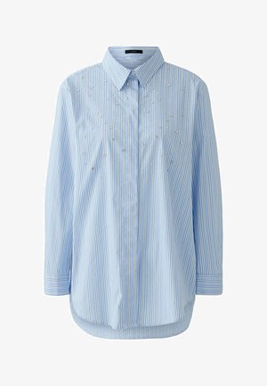 Light blue striped shirt featuring a button-down collar, long sleeves, and decorative silver embellishments on the front panel.