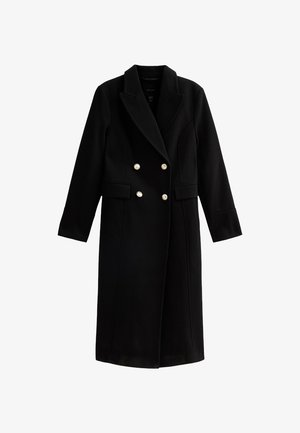 Manteau noir croisé avec un design ajusté, fabriqué en un mélange de laine lisse. Présente des boutons dorés et des poches latérales. Manches longues.