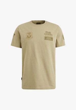 Khaki Baumwoll-T-Shirt mit kurzen Ärmeln, ausgestattet mit geprägten Patches mit Text. Rundhalsausschnitt und gerade Saum.