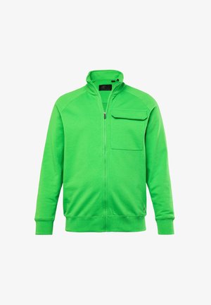 Groene ritstrui gemaakt van zachte stof, met een opstaande kraag en een borstzak met een gestructureerd oppervlak.