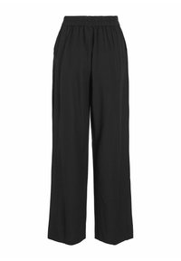 Pantalones anchos y negros, confeccionados con una tela ligera, que presentan una cinturilla elástica, un corte holgado y dos bolsillos laterales.