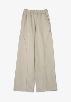 Beiga vida byxor med elastisk midja, sidofickor och kontrasterande sömmar för ökad textur. Mjuk, lättviktig tyg.
