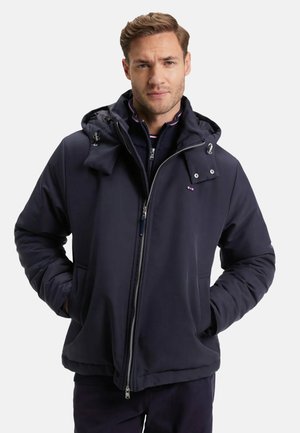 Veste rembourrée bleue marine avec une fermeture éclair à l'avant, une capuche, des poches latérales et une finition texturée. Comprend des accessoires en acier inoxydable et une taille ajustée.