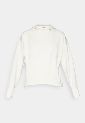 Fehér kapucnis pulóver hosszú ujjal, laza fazonban, oldalsó cipzárokkal és kis logóval a mellrészen. Puha anyag, minimalista dizájn.