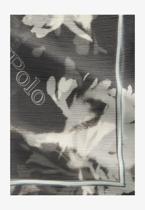 Czarno-biały kwiatowy wzór na tkaninie z abstrakcyjnymi kwiatami i subtelnym tekstem "a polo", częściowo widocznym przy krawędzi.