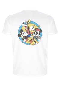 Vit bomullst-shirt med en färgglad illustration av tecknade figurer i en cirkulär design på baksidan. Mjuk textur, avslappnad passform.