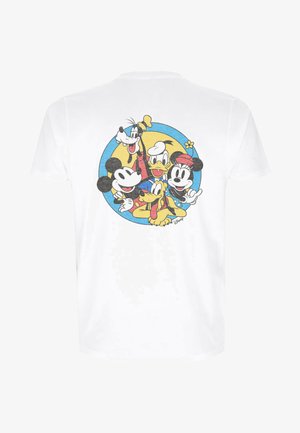 T-shirt in cotone bianco con un'illustrazione colorata di personaggi dei cartoni animati in un design circolare sul retro. Texture morbida, vestibilità casual.