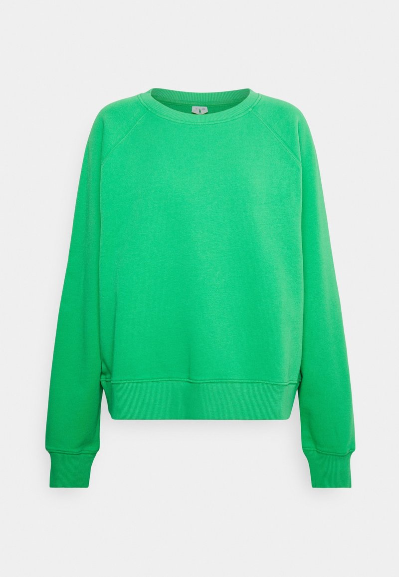 Sudadera verde con cuello redondo, mangas raglán, puños y dobladillo acanalados. Fabricada con un tejido suave y de textura lisa.