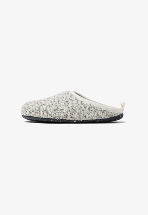 Grey and white patterned slipper with a soft, textured upper, slip-on design, and a black, speckled rubber sole. Reinforced heel loop.