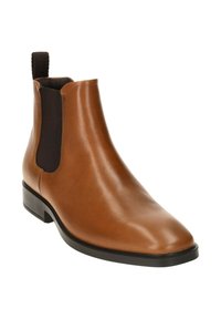 Stivale Chelsea in pelle marrone con pannelli laterali elasticizzati, punta affusolata e tacco basso nero. Texture liscia con una finitura elegante.