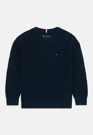 Sweater malha azul marinho com um padrão de ponto texturizado. Apresenta um decote redondo e punhos e bainha em canelado. Pequeno logótipo no peito.