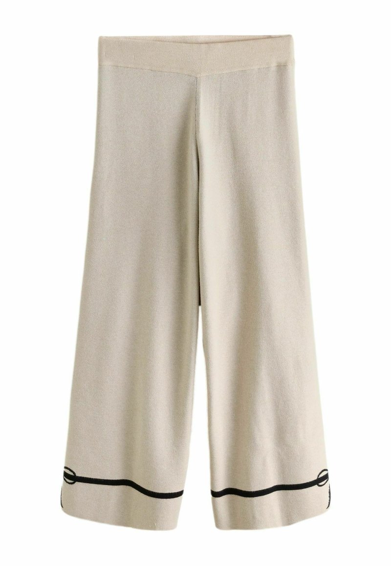 Beežid laia lõikega püksid soonikkoes vöökohaga, millel on must horisontaalne rõhutusjoon ääre lähedal. Pehme kangas, sileda tekstuuriga.