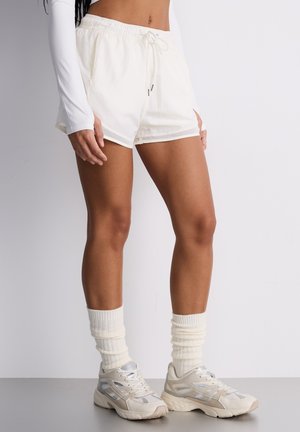 UNITA - Pantaloni sportivi - bianco ottico