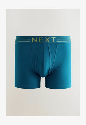Sinine bokseršortid, mis on tihedalt istuvad, millel on kuldne "NEXT" logo vööl ja minimalistlikud horisontaalsed triibud. Pehme kangastekstuuri.