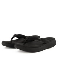 Black flip-flops with a textured rubber sole and soft straps. Features a minimal design with a logo on the strap and a slight heel.