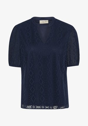 Navy blue short-sleeve top with a V-neck, textured geometric pattern, and open lace detailing at the hem and sleeves. Soft fabric.