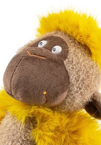 Stuffed monkey toy with brown face, beige fur, bright yellow fluffy mane, and wide-eyed expression.